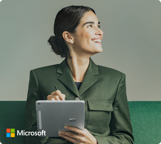 Professional woman holding a Microsoft Surface Laptop.