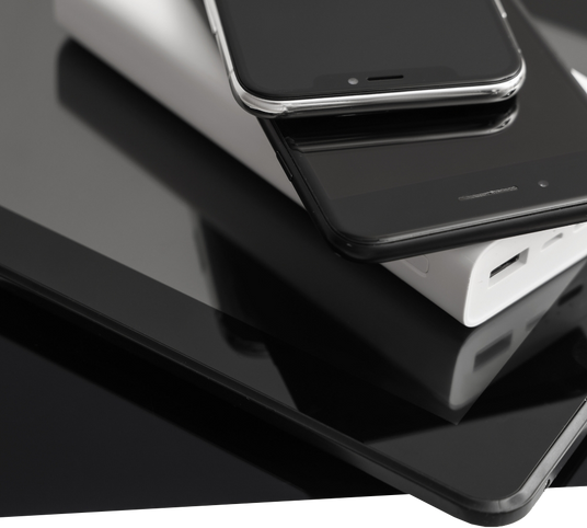 Stack of smartphones and devices symbolising reuse, recovery, and responsible recycling of ICT equipment.