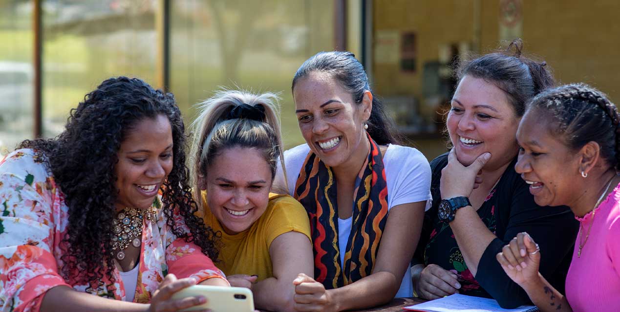 People sharing a moment, supporting digital inclusion in Australia through Catalysing Connections.