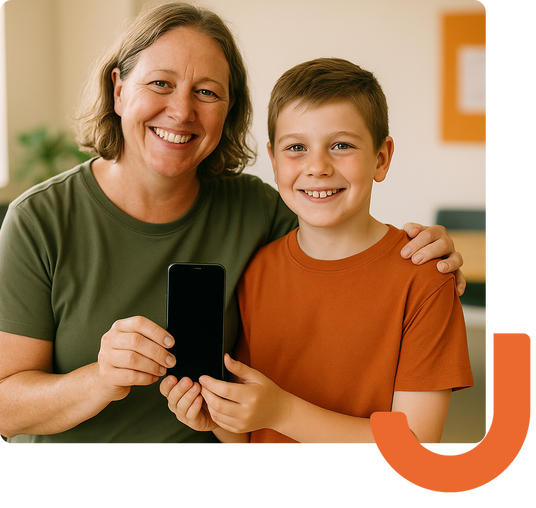 Smiling adult and child holding a smartphone together, representing how refurbished devices create meaningful human connections.