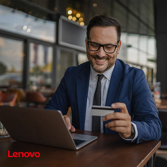 Business professional using Lenovo laptop with carbon neutral supply